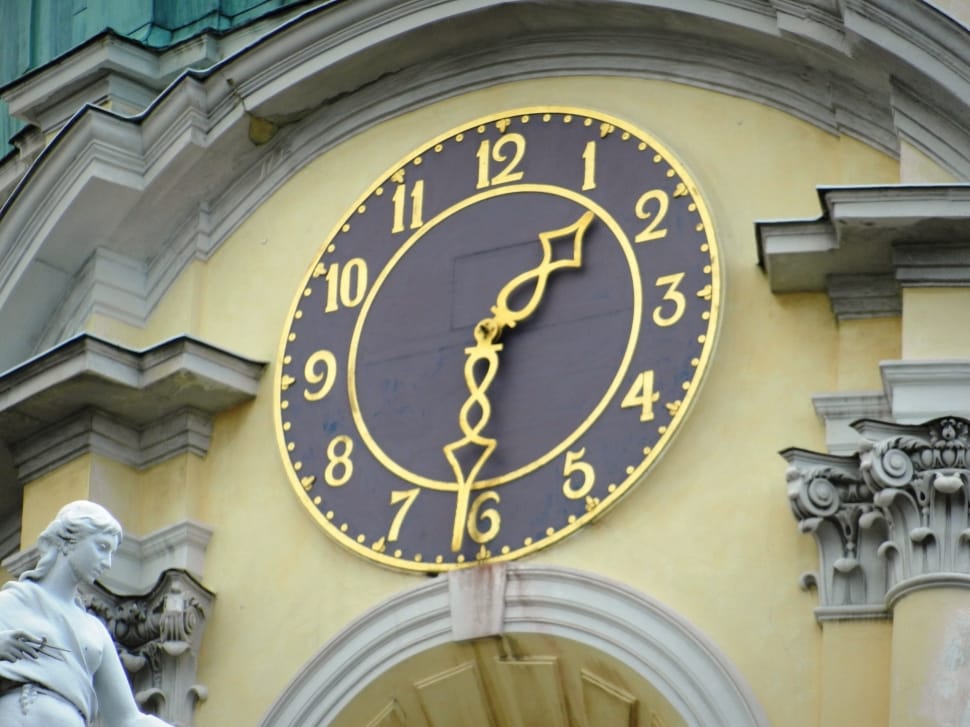 black and gold clock building preview
