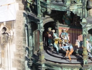 toddler's group of men figurine in castle thumbnail