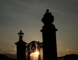 silhouette of gate during sunset thumbnail