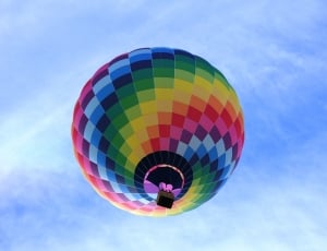 multicolored air balloon floating on the sky during daytime thumbnail