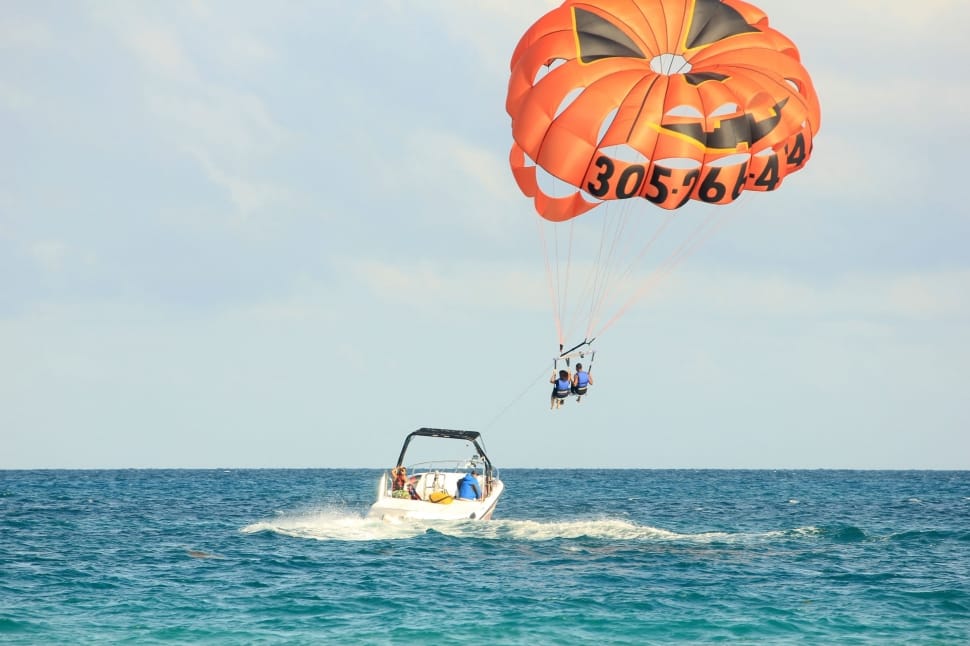 group of people parasailing on ocean preview
