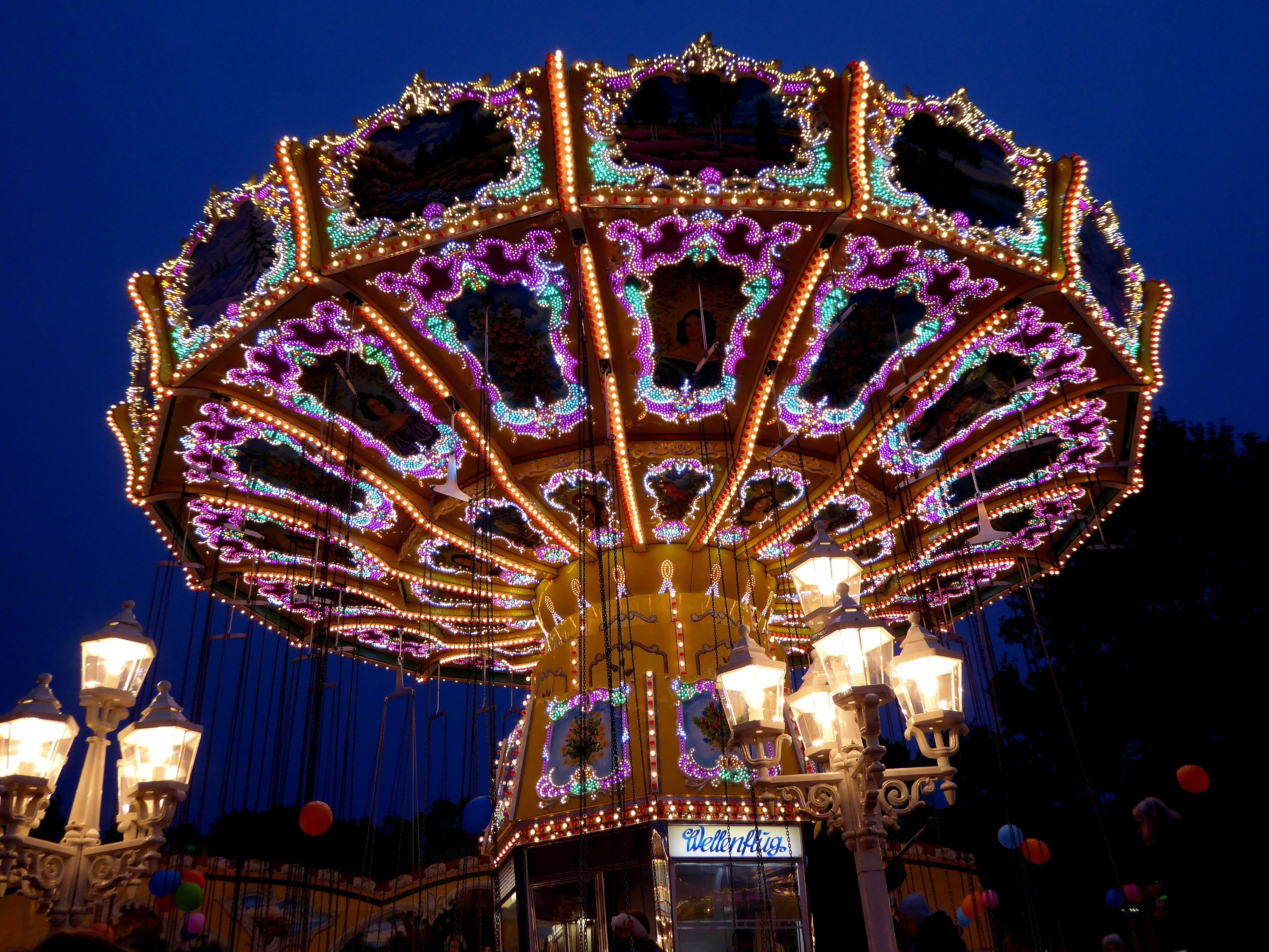 lighted amusement ride during night time