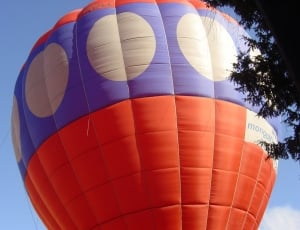 blue,white,and orange hot air balloon thumbnail