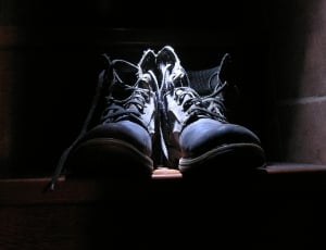 pair of black leather lace-up boots thumbnail