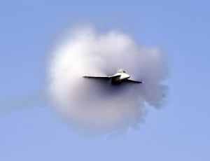 white aircraft flying during daytime thumbnail