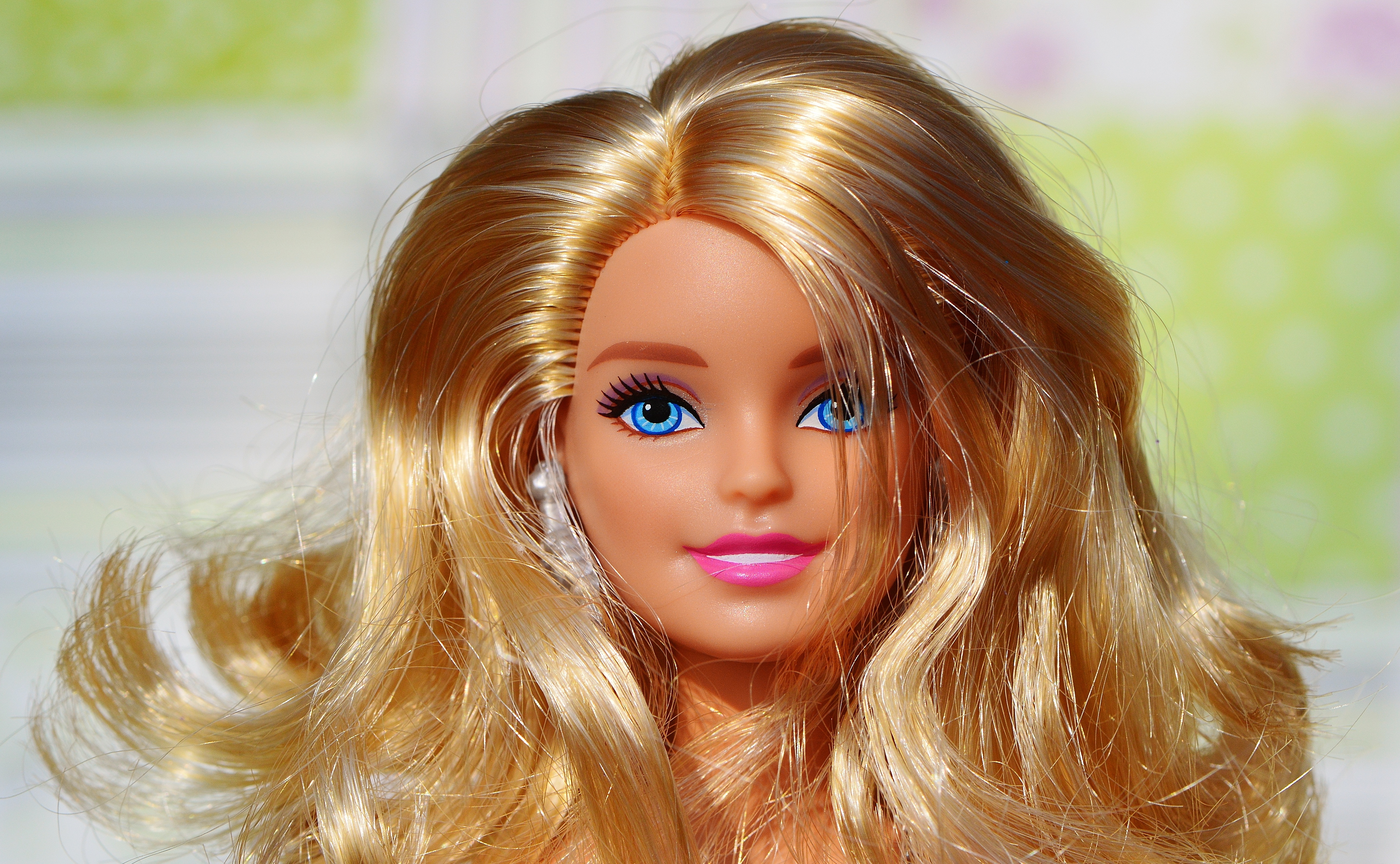 smiling barbie doll with blonde hair