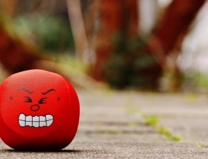 red plastic round toy thumbnail