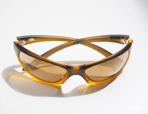 brown and yellow framed sports sunglasses thumbnail