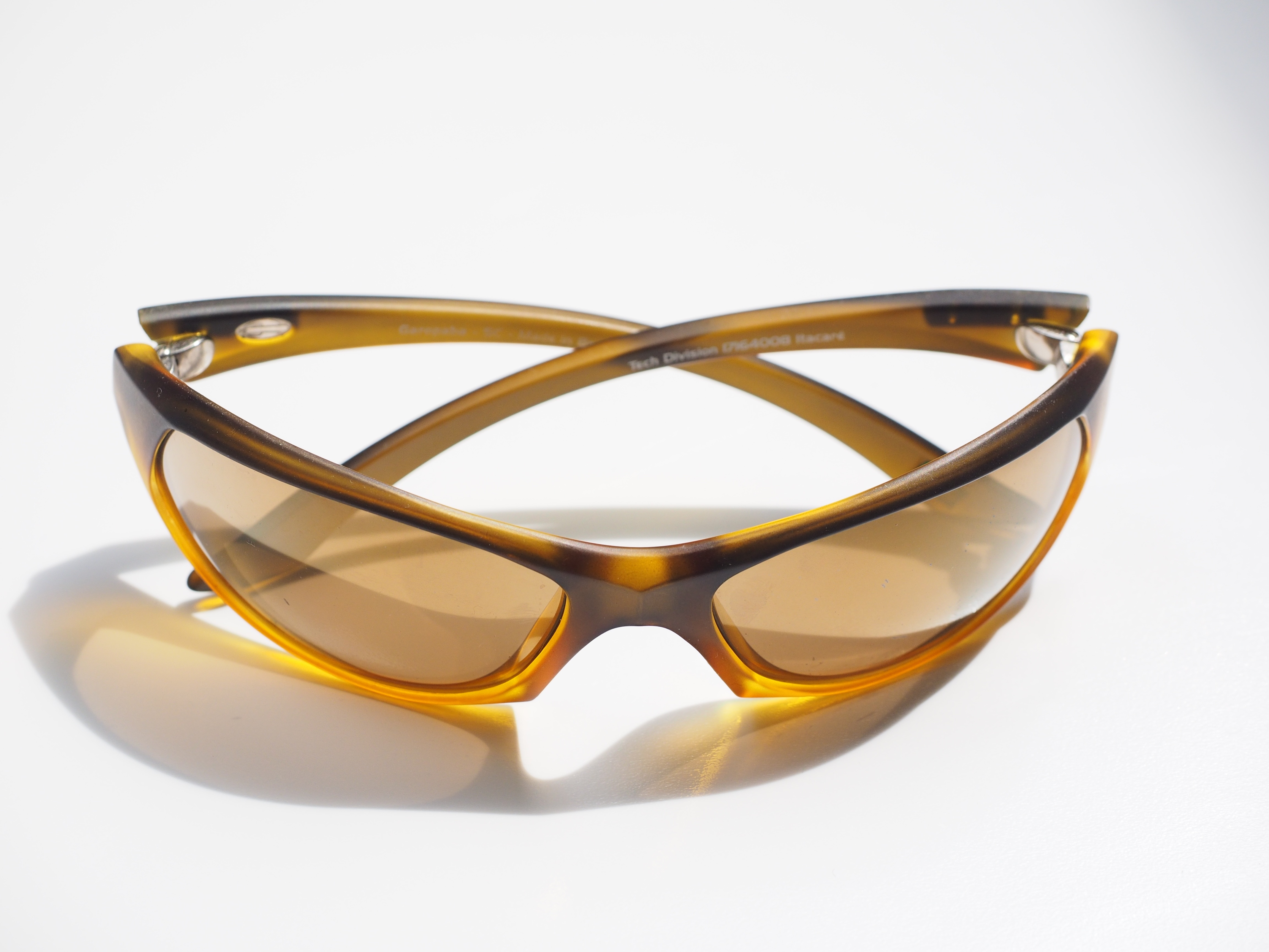 brown and yellow framed sports sunglasses