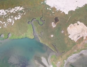areal view of body of water and land thumbnail