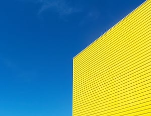 yellow building under clear blue sky thumbnail