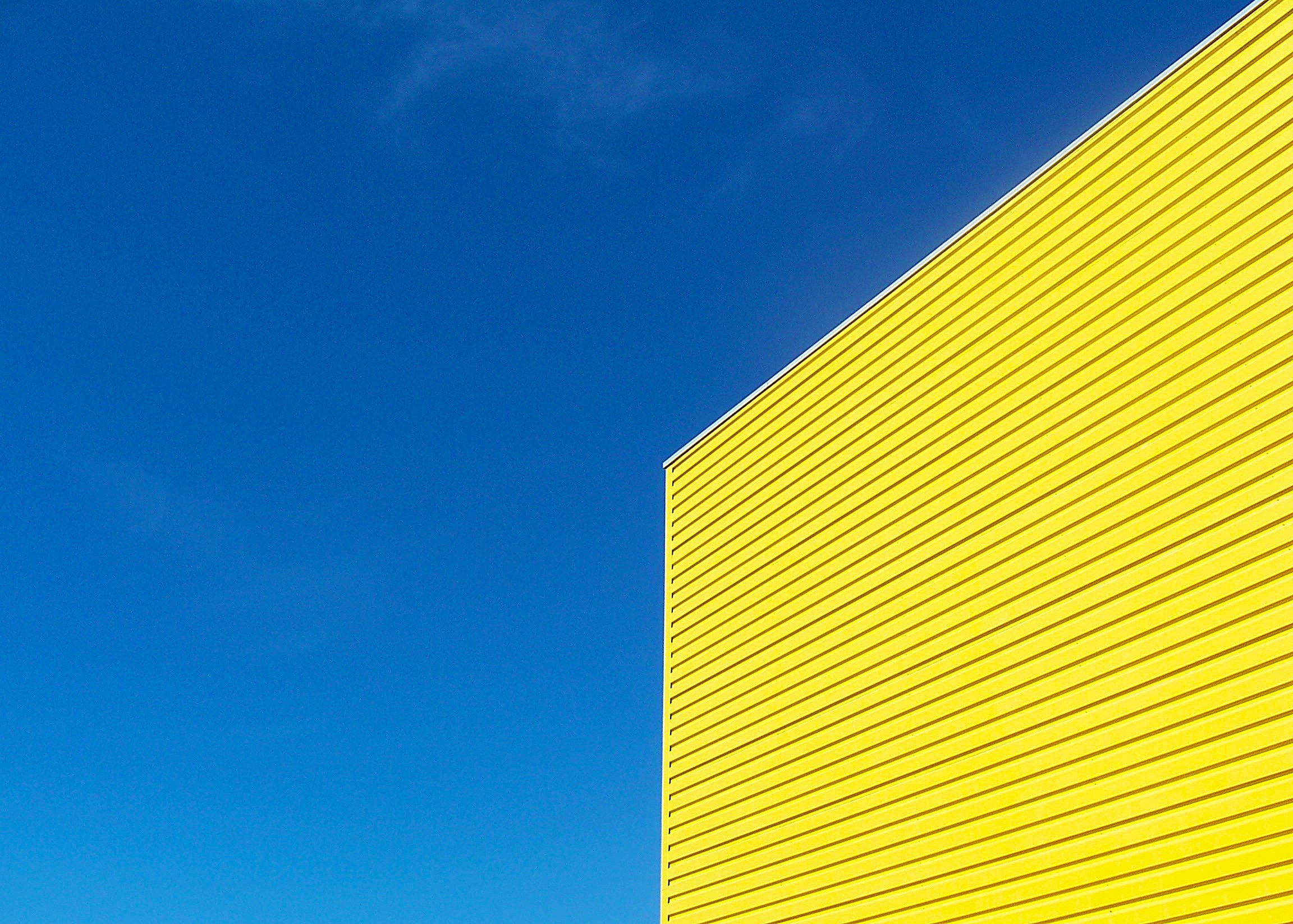 yellow building under clear blue sky