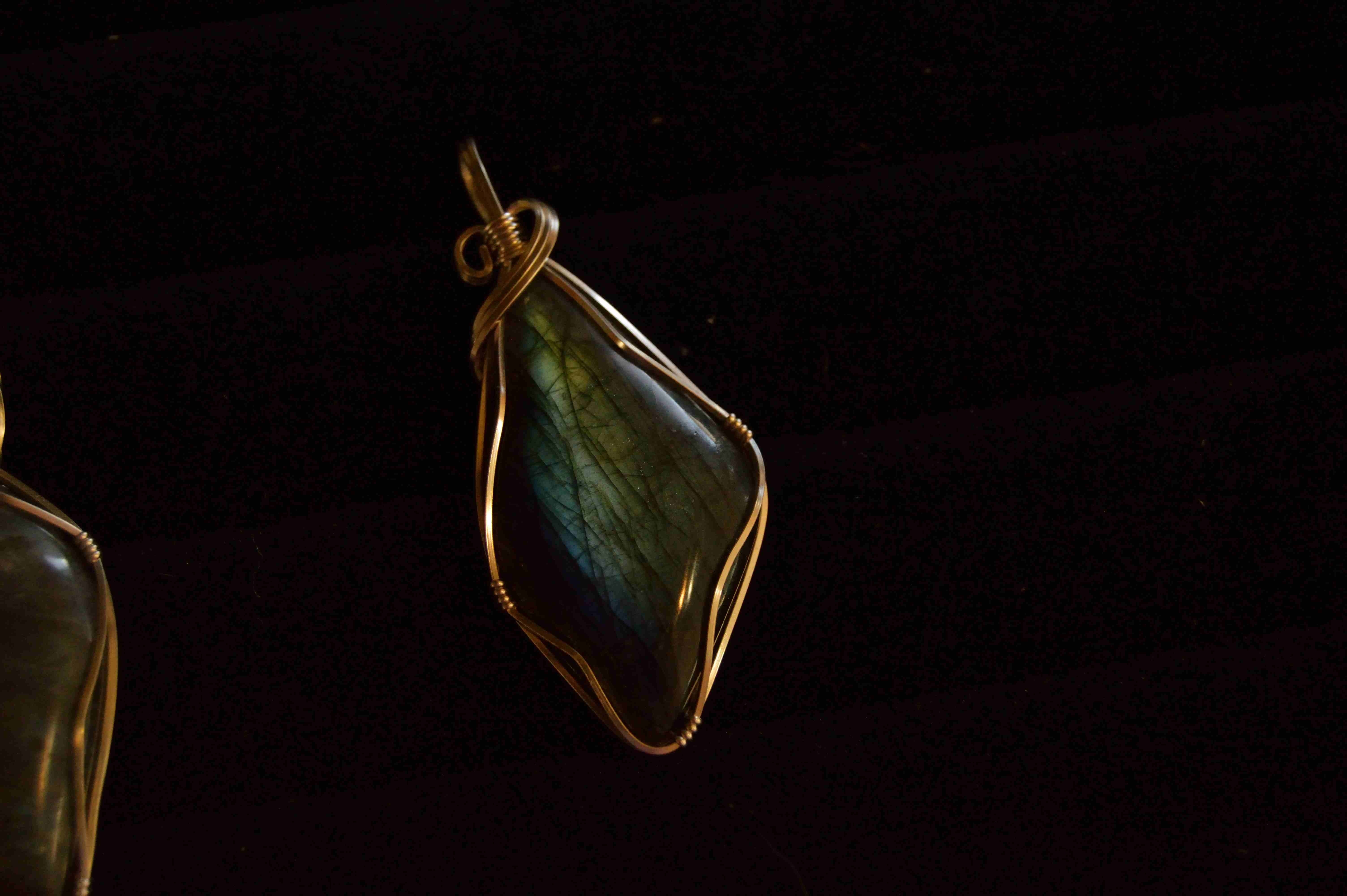 pair of bronze framed emerald pendant earrings