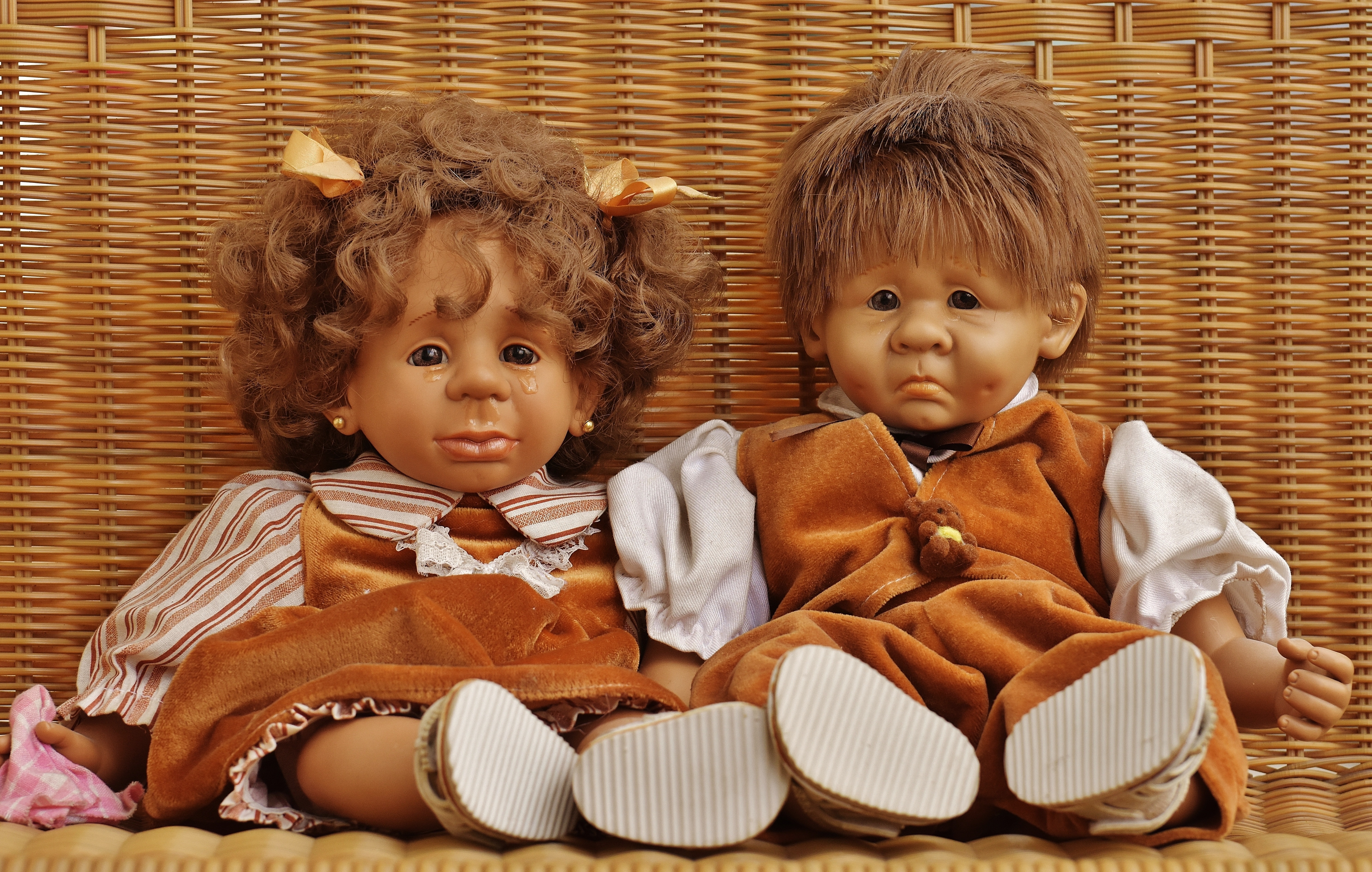 man and woman crying dolls