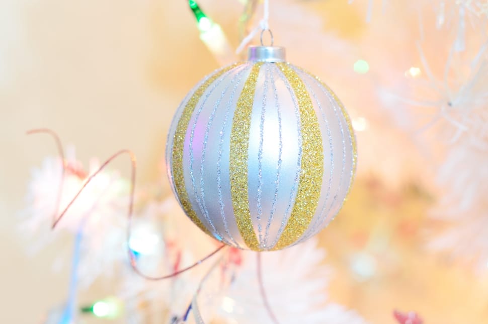 close-up photography of white and yellow baubles preview