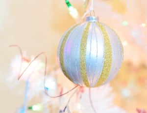 close-up photography of white and yellow baubles thumbnail