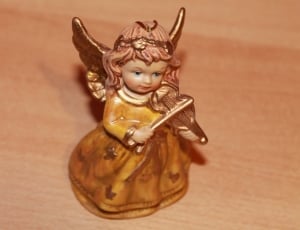 brown ceramic angel figurine thumbnail