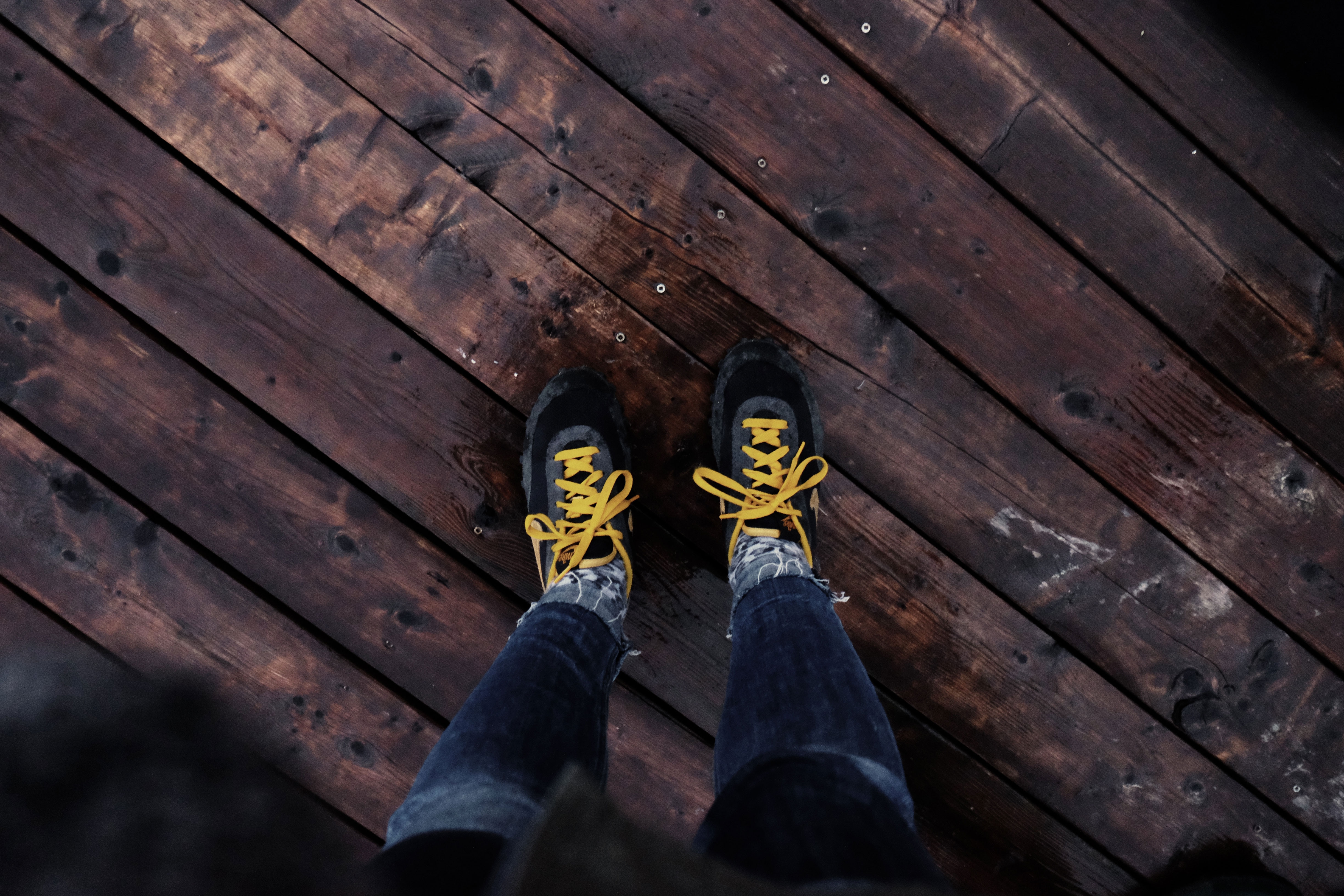 pair of black gray and yellow sneakers