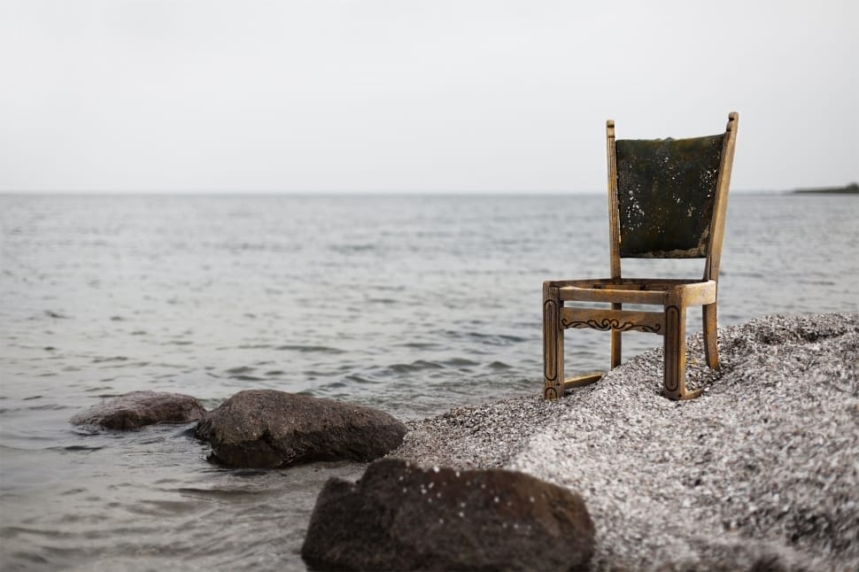 brown wooden chair near seashore preview