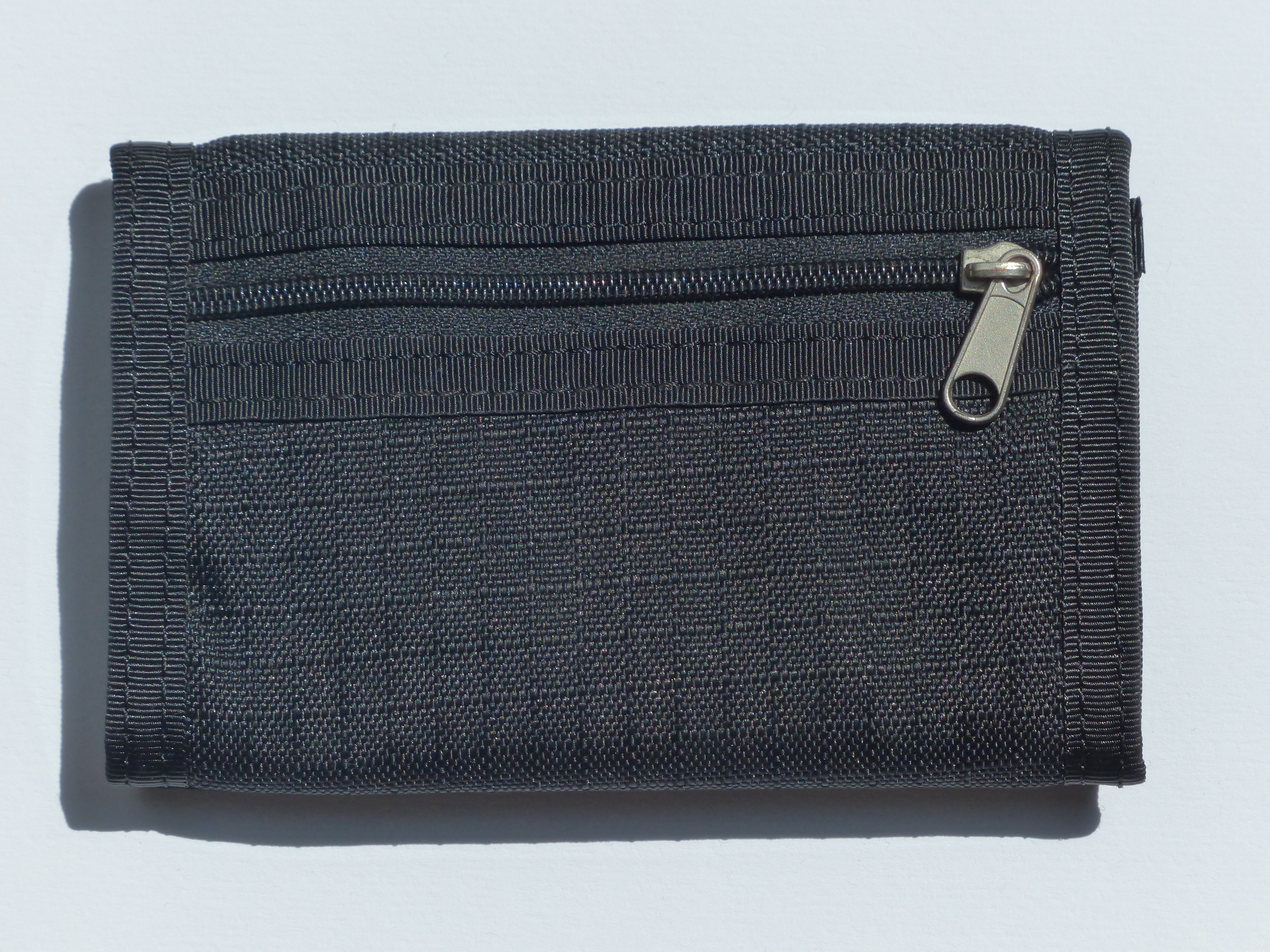black tri-fold wallet