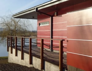 red wooden single storey house thumbnail