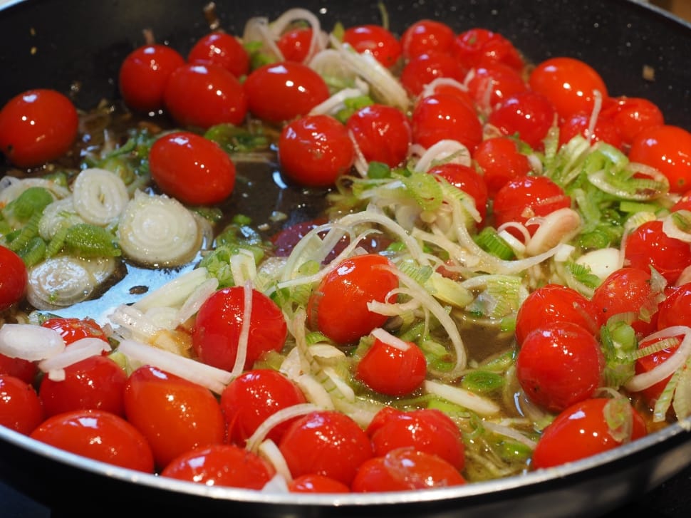 red cherry tomatoes in cooking pot preview