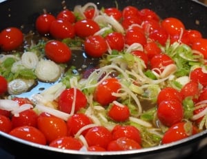 red cherry tomatoes in cooking pot thumbnail