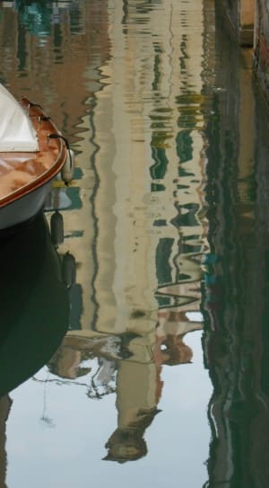 brown and white wooden boat thumbnail