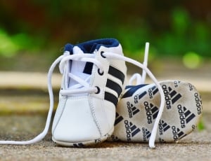 toddler's white adidas low tops thumbnail