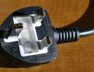black and white electrical plug with grounding pin thumbnail