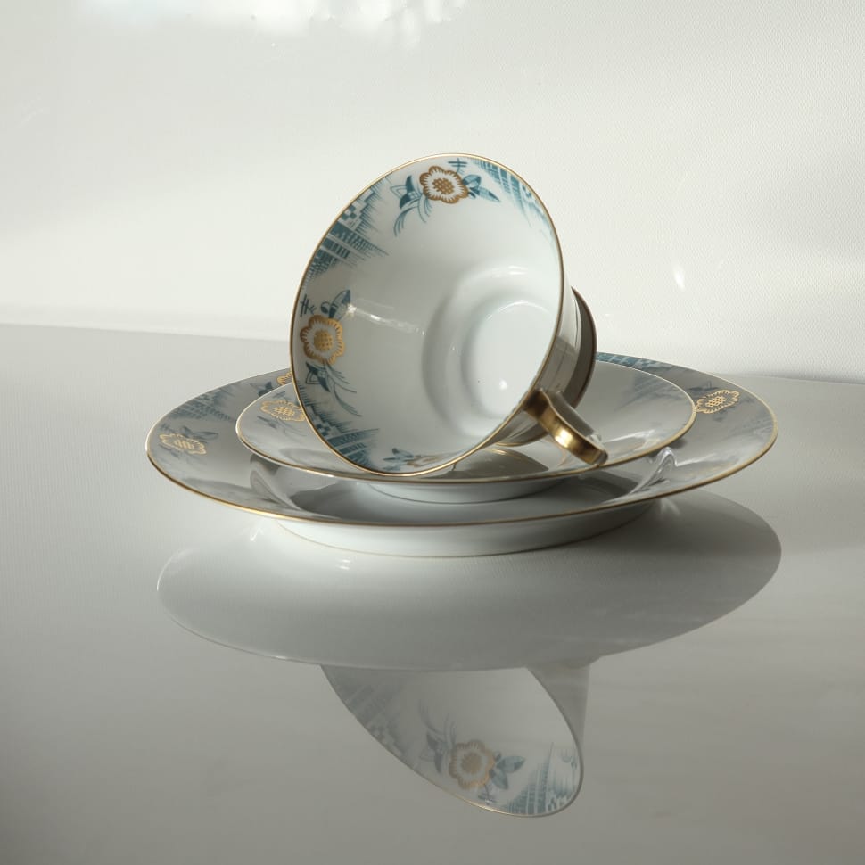 white blue and brown floral ceramic teacup and saucer preview