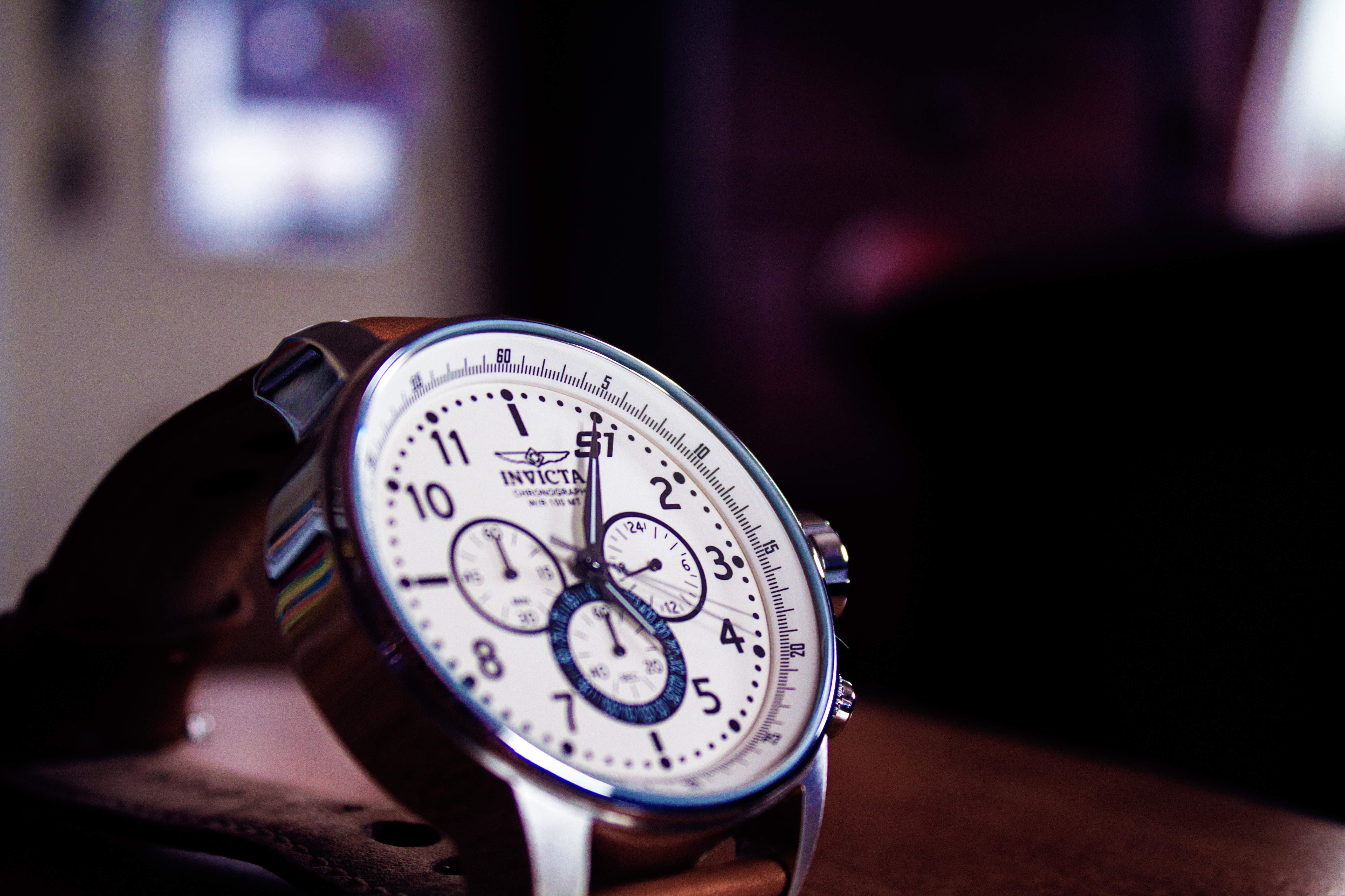silver round invicta chronograph watch
