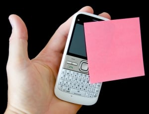 person holding white qwerty phone thumbnail