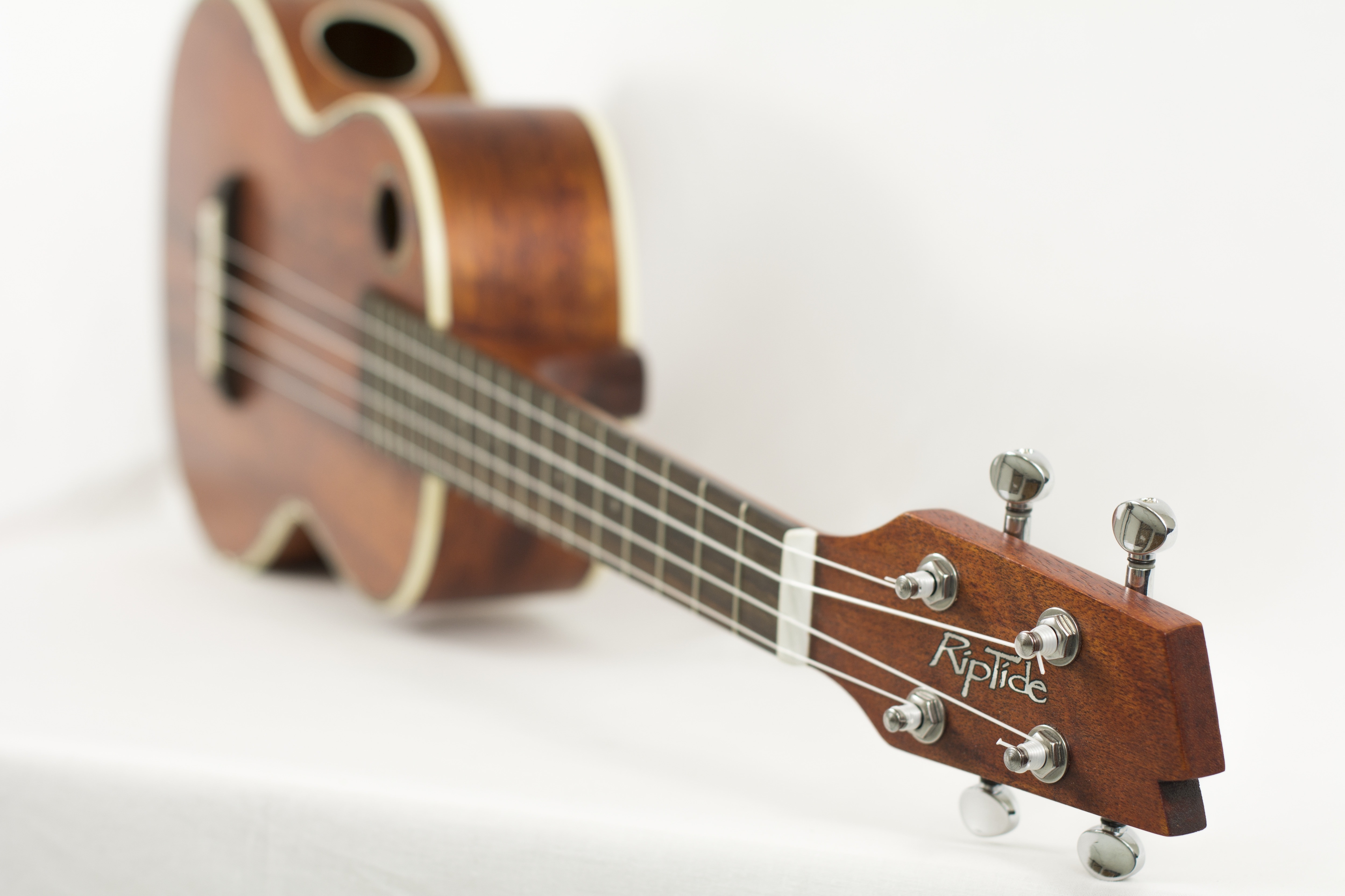 side view of brown RipTide ukulele