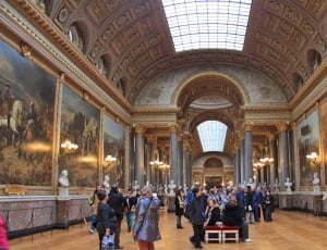 group of people in gallery during daytime thumbnail