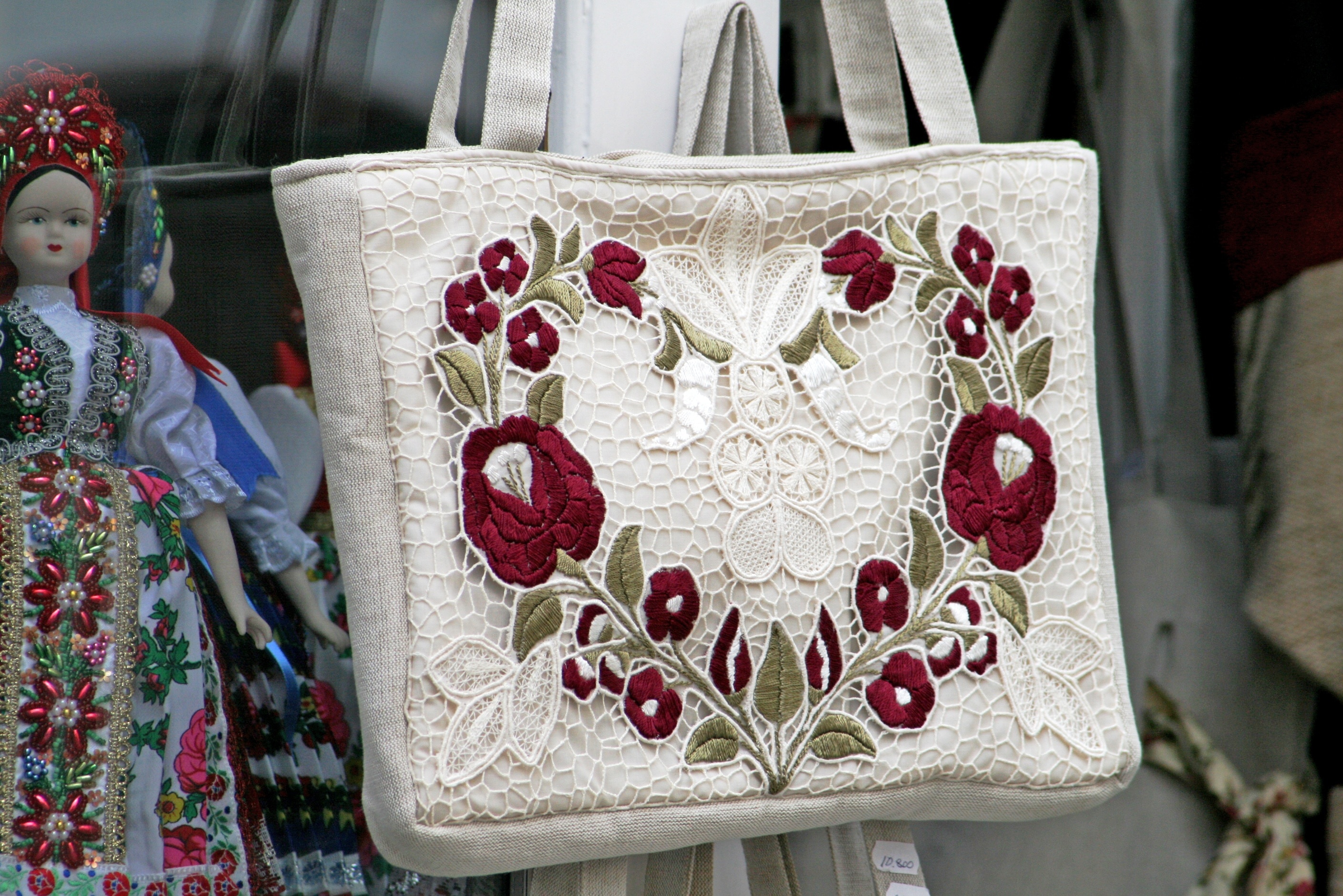 white and red floral handbag