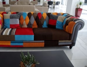 orange black red and brown couch thumbnail