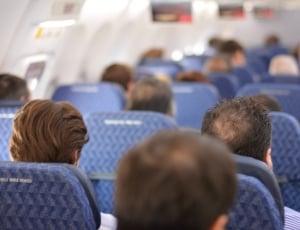 group of people sitting on chair inside the airplanee thumbnail