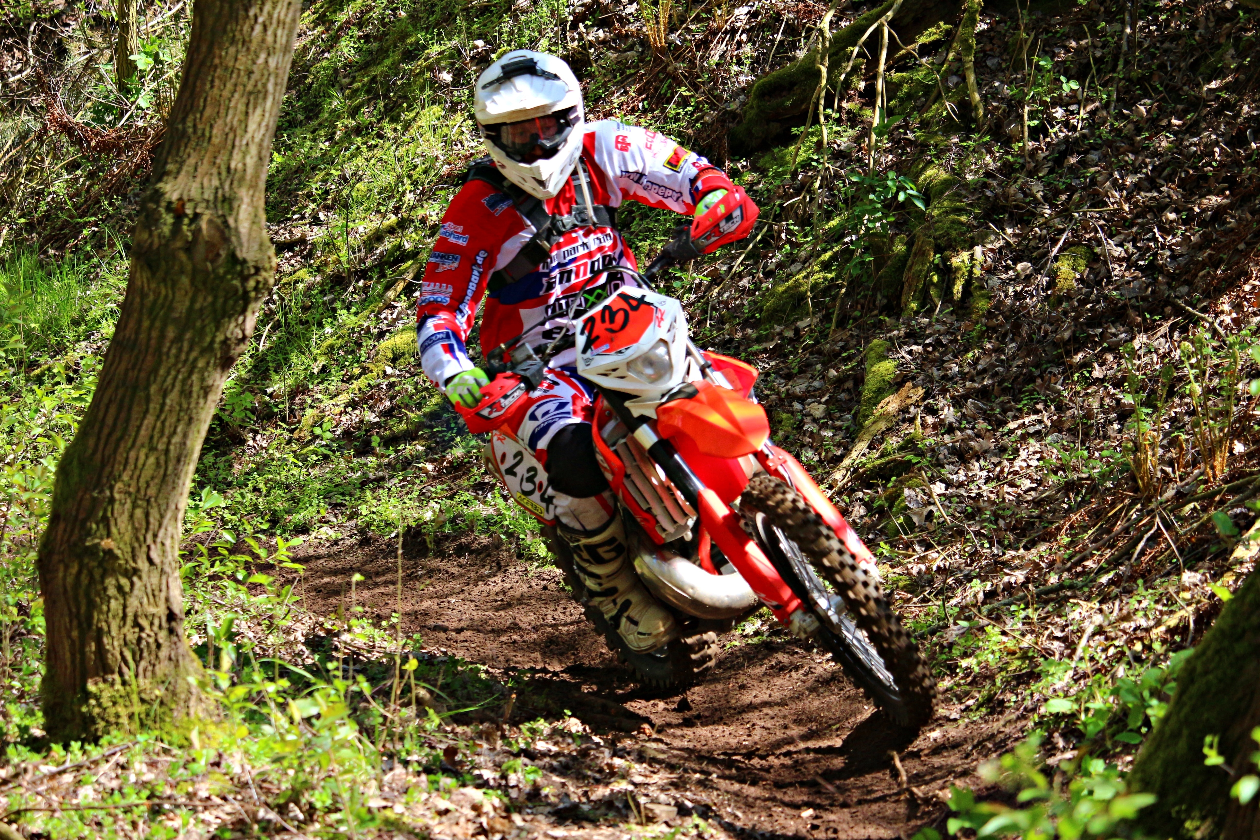 red and white dirt bike helmet