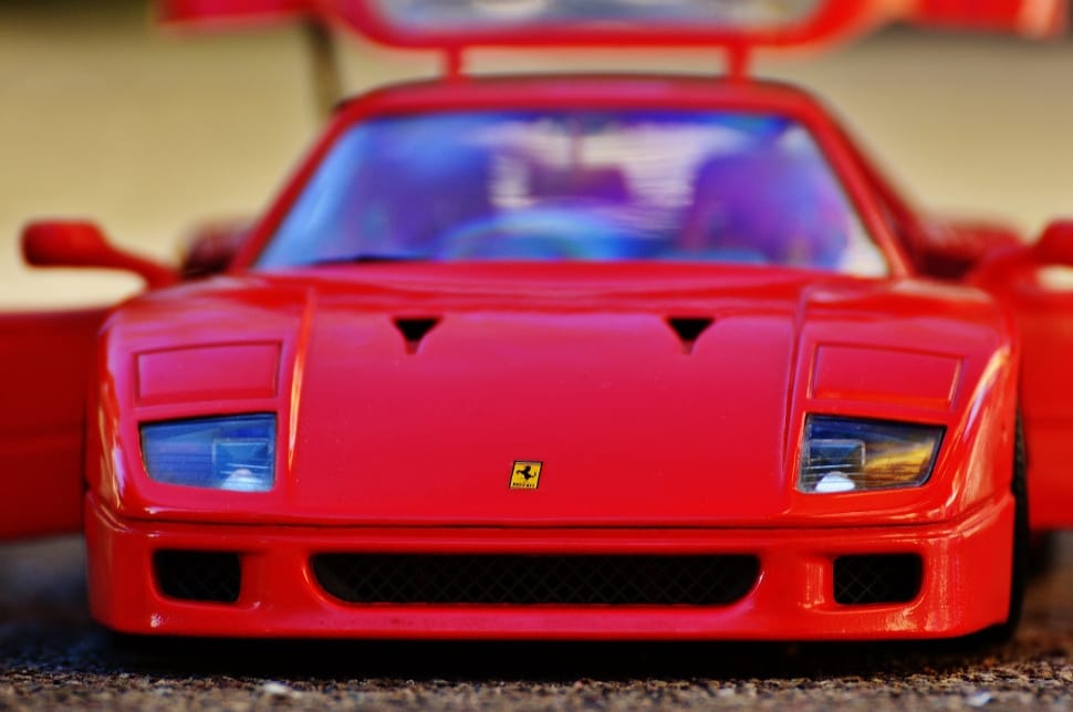 selective focus photo of red Ferrari F40 die cast scale model preview