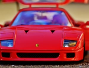 selective focus photo of red Ferrari F40 die cast scale model thumbnail