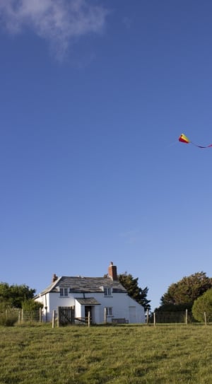 flying kite during day time thumbnail