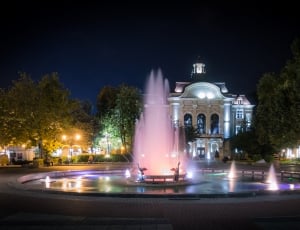 round fountain under black sky during night time thumbnail