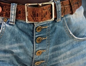 blue faded jeans and brown leather belt thumbnail
