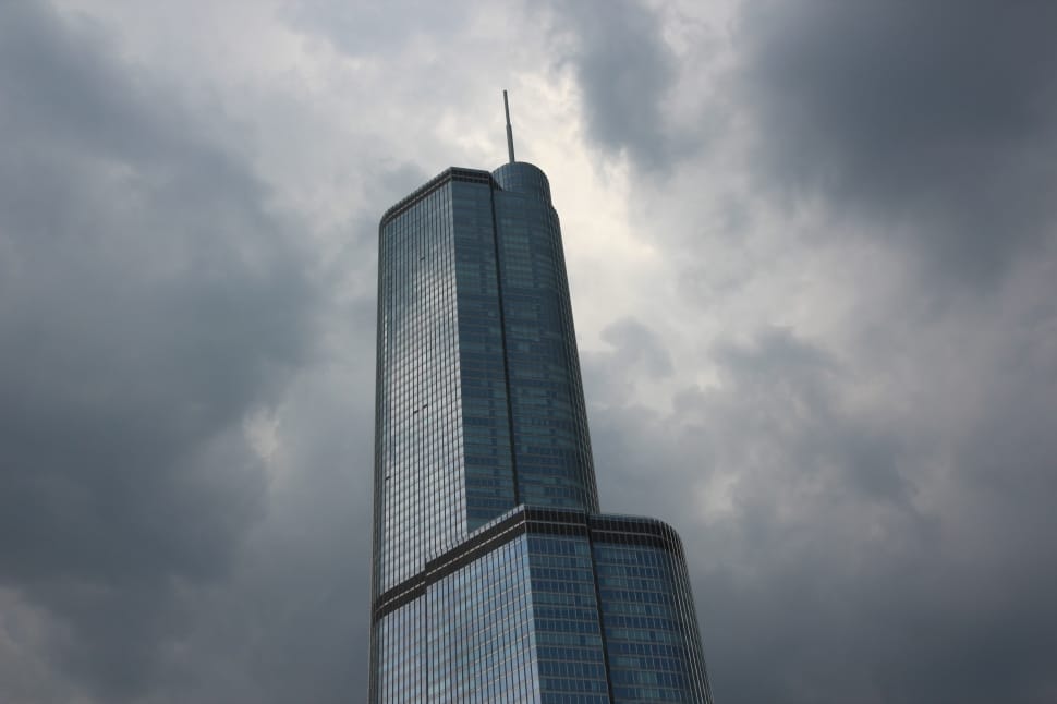 low angle photo of curtain wall high rise building under gray clouds preview