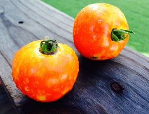 2 orange round fruits thumbnail
