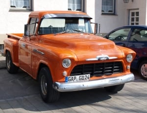 orange classic single cab pickup truck thumbnail