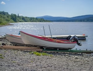 white and red wooden boats thumbnail