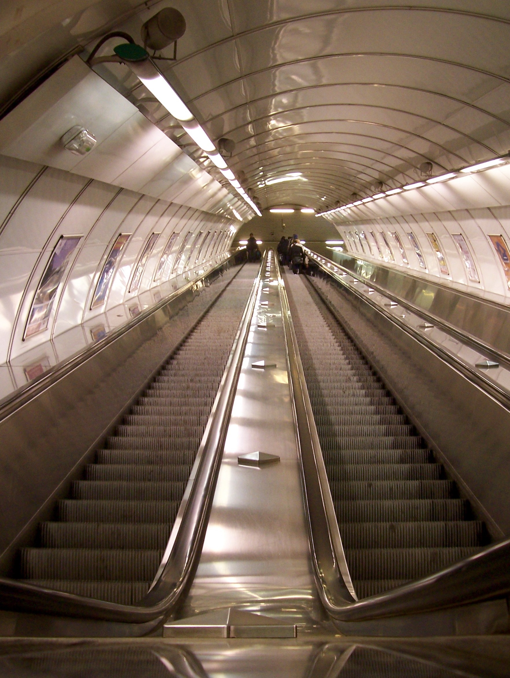 gray tunnel escalator