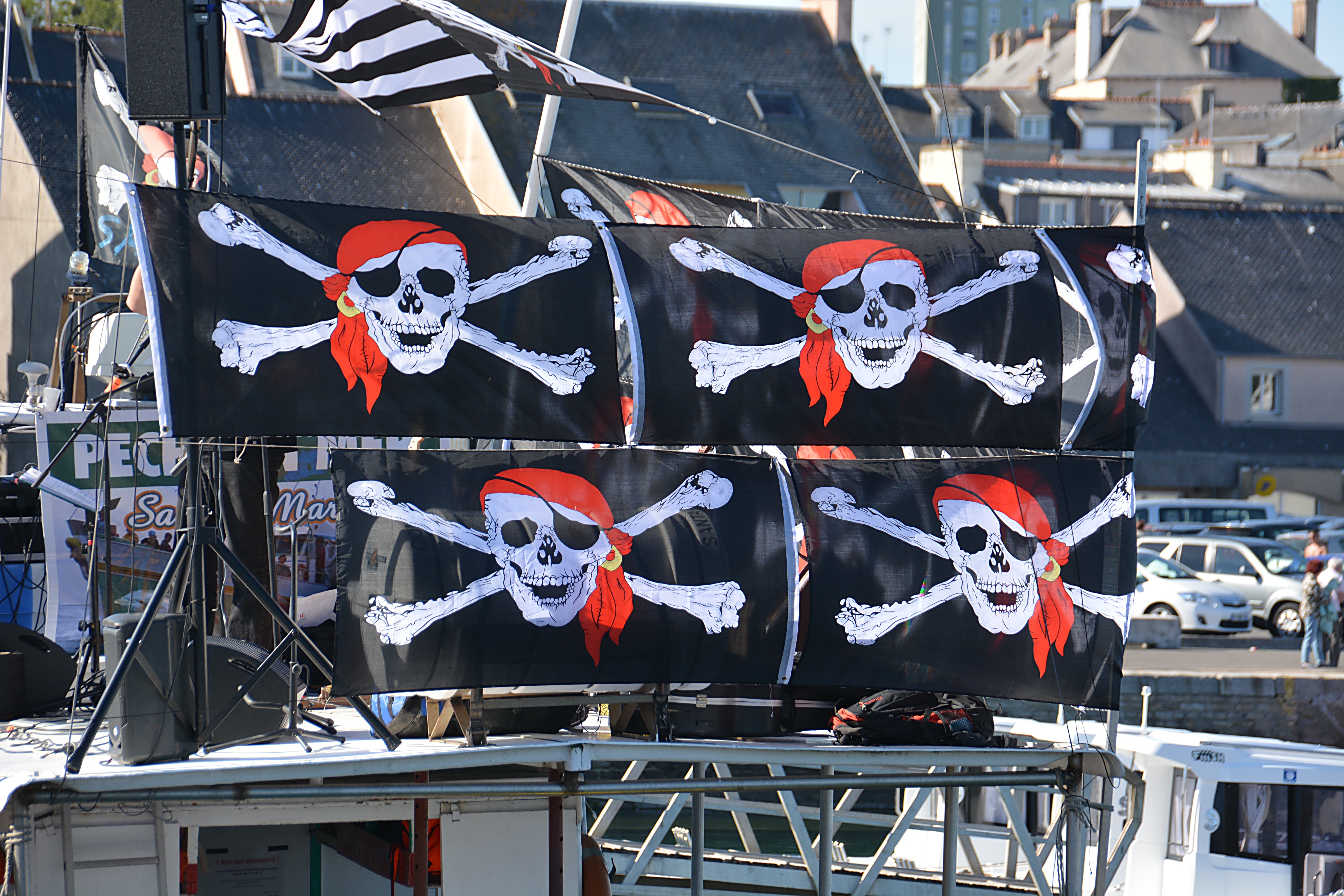 four black pirate flags